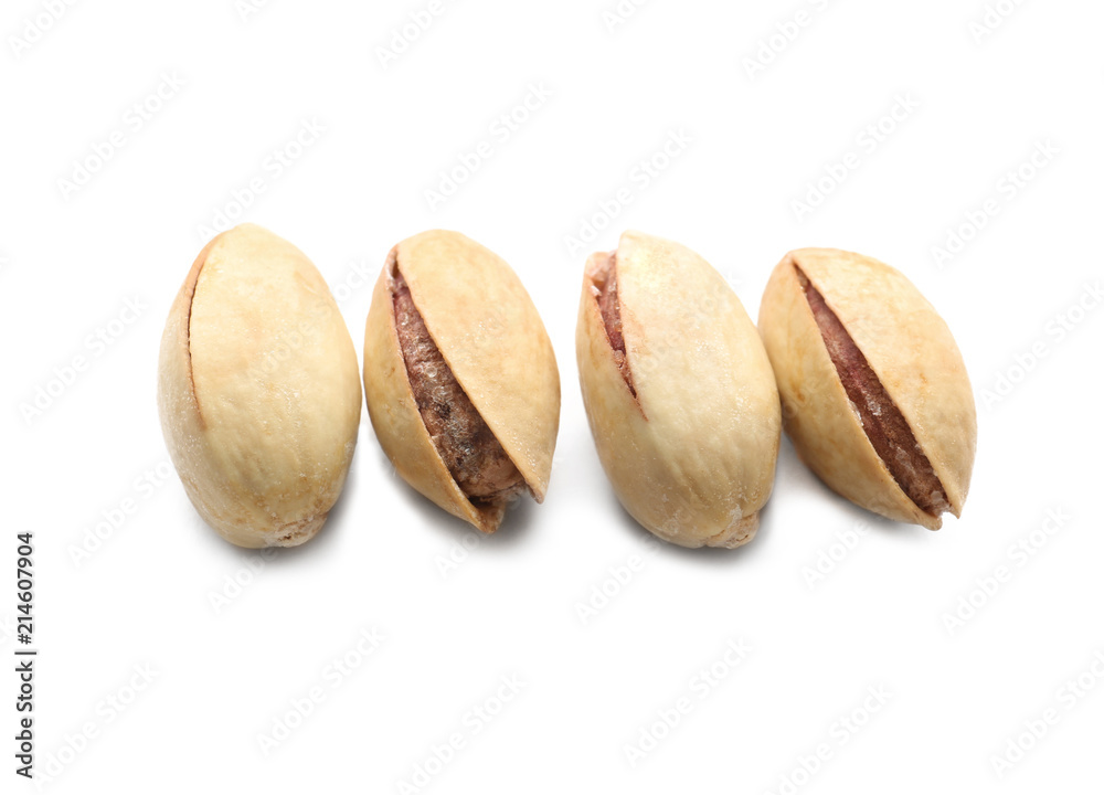 Tasty pistachio nuts on white background
