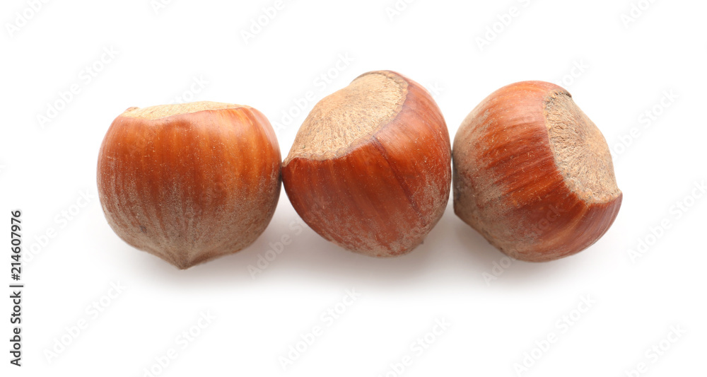 Tasty hazelnuts on white background