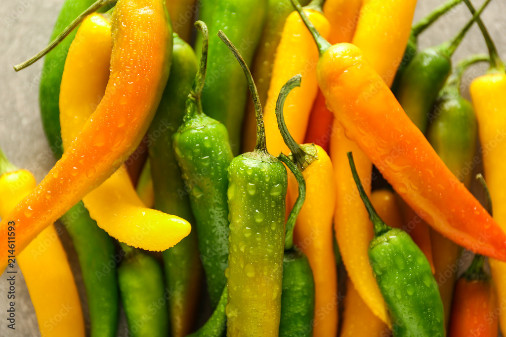 Fresh chili peppers on table, closeup