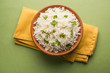 Coriander or cilantro Basmati Rice, served in a ceramic or terracotta bowl. It's a popular Indian OR Chinese recipe. Selective focus