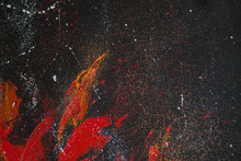 Red Smears Of Orange Paint On A Black Background