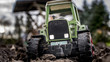 © cash-n-style - Traktor auf dem Feld Spielzeug Nahaufnahme