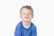 Three years old kid and emotions, close-up portrait of happy smiling child with with closed eyes at white background