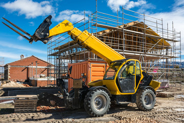 Wall Mural - Construction of a single-family house. Building the external structure with a load elevator