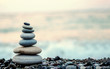Leinwandbild Motiv made of stone tower on the beach and blur background