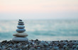 Leinwandbild Motiv made of stone tower on the beach and blur background