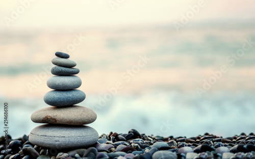 made of stone tower on the beach and blur background Canvas Print