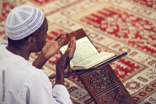 African Muslim Man Making Traditional Prayer To God While Wearing Dishdasha Canvas Print