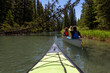 © edb3_16 - Couple adventurous friends are canoeing in a river surrounded by the Canadian nature. Taken in Vermilion Lakes, Banff, Alberta, Canada.