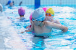 © FS-Stock - happy kids at the swimming pool. young and successful swimmers pose.