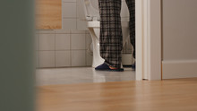 Adult Man In A Toilet At Home