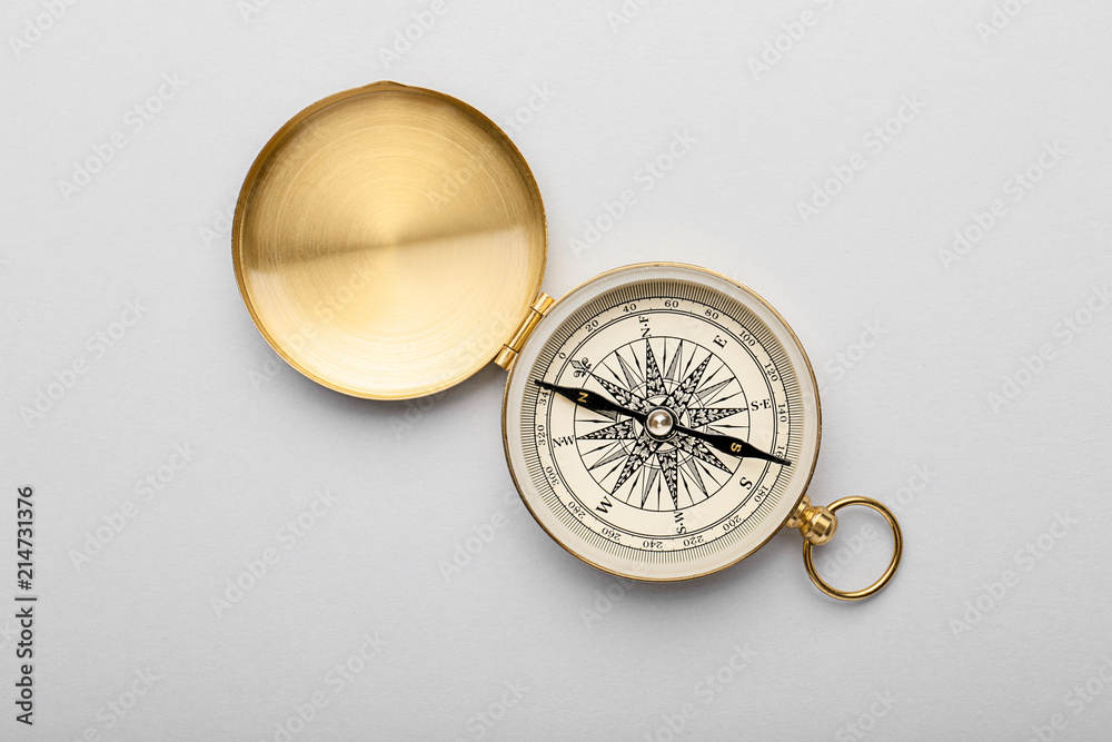 Vintage compass on light background