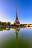 Fototapeta Boho - View of Eiffel Tower and river Seine at sunrise in Paris, France. Eiffel Tower is one of the most iconic landmarks of Paris