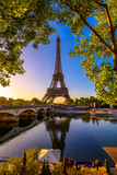 Fototapeta Most - View of Eiffel Tower and river Seine at sunrise in Paris, France. Eiffel Tower is one of the most iconic landmarks of Paris