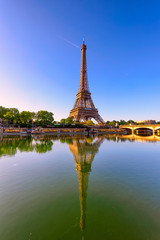 view of eiffel tower and river seine at sunrise in paris, france. eiffel tower is one of the most ic