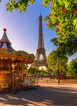 Carousel And Eiffel Tower On Background In Paris, France.
