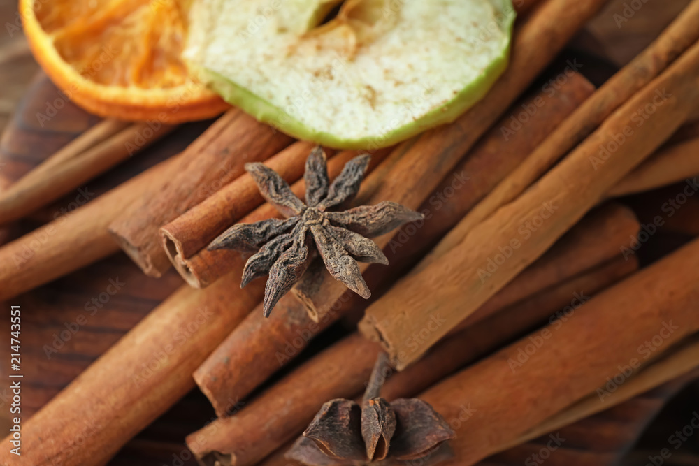 Cinnamon sticks and anise stars on table, closeup