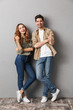 © Drobot Dean - Full length portrait of a cheerful young couple standing