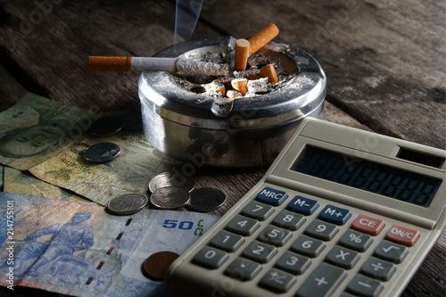 Cigarette And Calculator With Money In Concept How Many Cost You Cigarette And Calculator With Money In Concept How Many Cost You Pay To Year Month Day