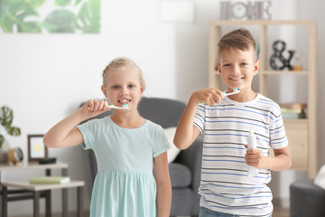 Wall Mural - cute little children brushing teeth at home