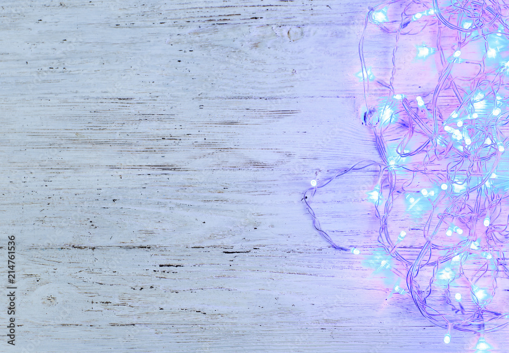 Beautiful bright Christmas garland on wooden background