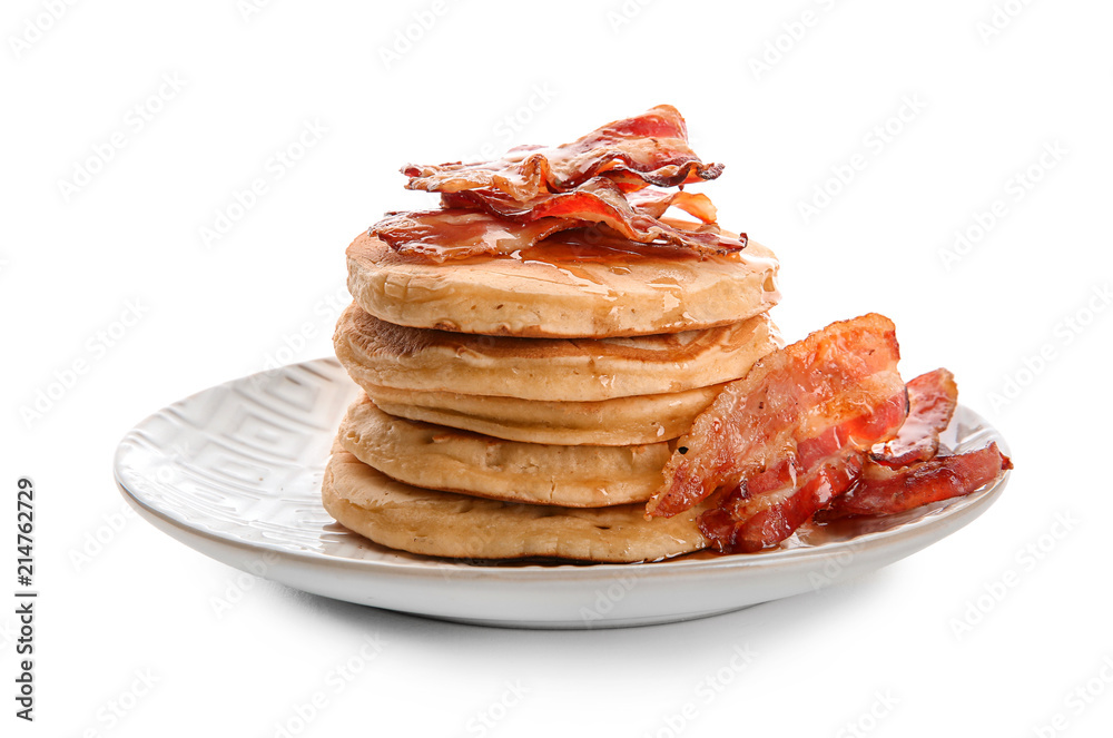 Tasty pancakes with fried bacon on white background
