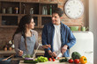 © Prostock-studio - Happy couple cooking healthy dinner together