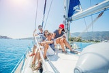 Fototapeta Mapy - Family with adorable kids resting on yacht