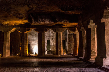 Wall Mural - Stone columns of the Buddhist monastery Ajanta Caves in Aurangabad, Maharashtra, India