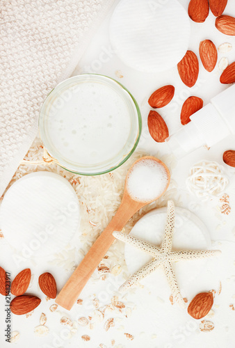 Homemade healing skincare lotion recipe with rice water and almond milk. Facial cleanser liquid soap in jar with nuts and oat flakes ingredients on white ... Homemade healing skincare lotion recipe with rice water and almond ...