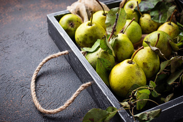 Fresh sweet organic pears in wooden box