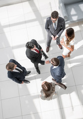 top view. handshake business partners at the meeting