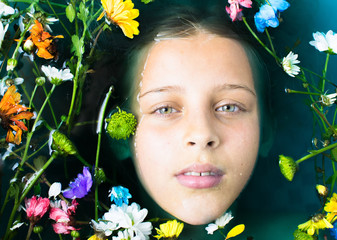 Wall Mural - girl teenager with green hair in the water