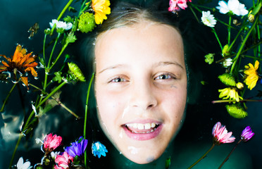 Wall Mural - girl teenager with green hair in the water