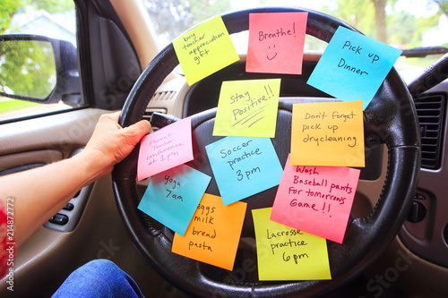 Fotografía Steering wheel covered in notes as a reminder of errands to do