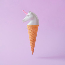 White Painted Unicorn Head Ice Cream On Pastel Purple Background. Minimal Art Fantasy Concept. Summer Fairytale.