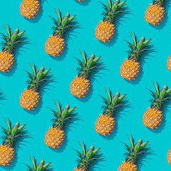 Wall Mural - pineapple creative tropical pattern vivid blue background. abstract summer art background. minimal p