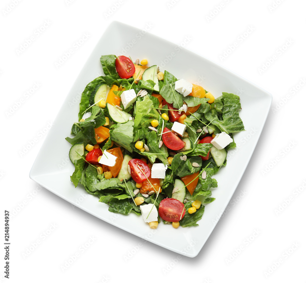 Plate with delicious fresh salad on white background