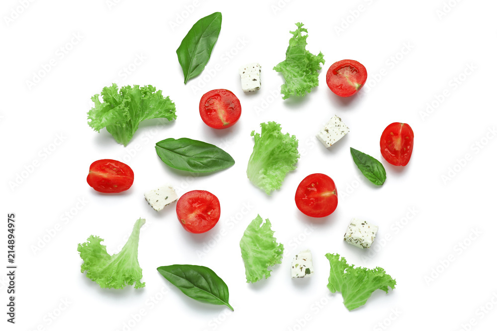 Composition with fresh tomatoes, herbs and cheese on white background