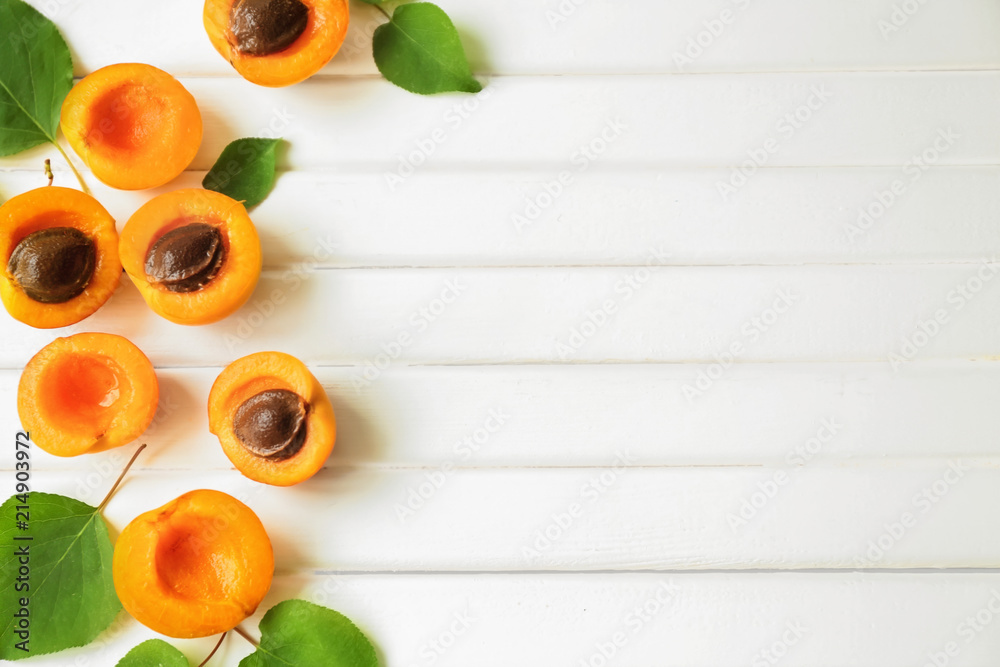 Fresh apricots on wooden table