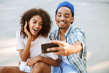 Wall Mural - Portrait of a cheerful young african couple