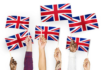 Wall Mural - Hands waving the Union Jack