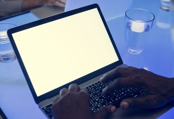 Hands using laptop on a cyber space table