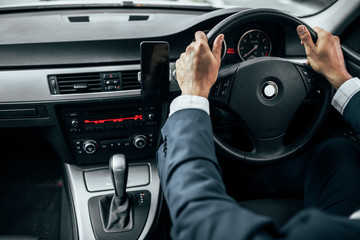 Businessman driving car