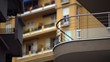 Windows of multistorey block of flats in European city, view of balconies