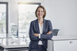 © Westend61 - Portrait of happy businesswoman in office