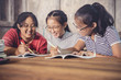 © stockphoto mania - three of cheerful asian teenager tutorial for school homework happiness emotion