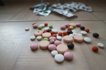 medical tablets and drugs of different shapes and colors for the treatment of diseases