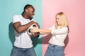 The unhappy and angry fans on colored blue and pink background.