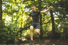 Fit Man Training Over Obstacle Course
